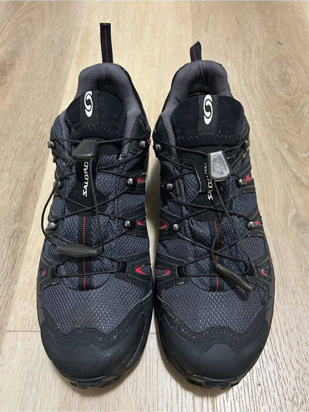 Salomon Men's Black and Gray Trail Sneakers with Red Accents